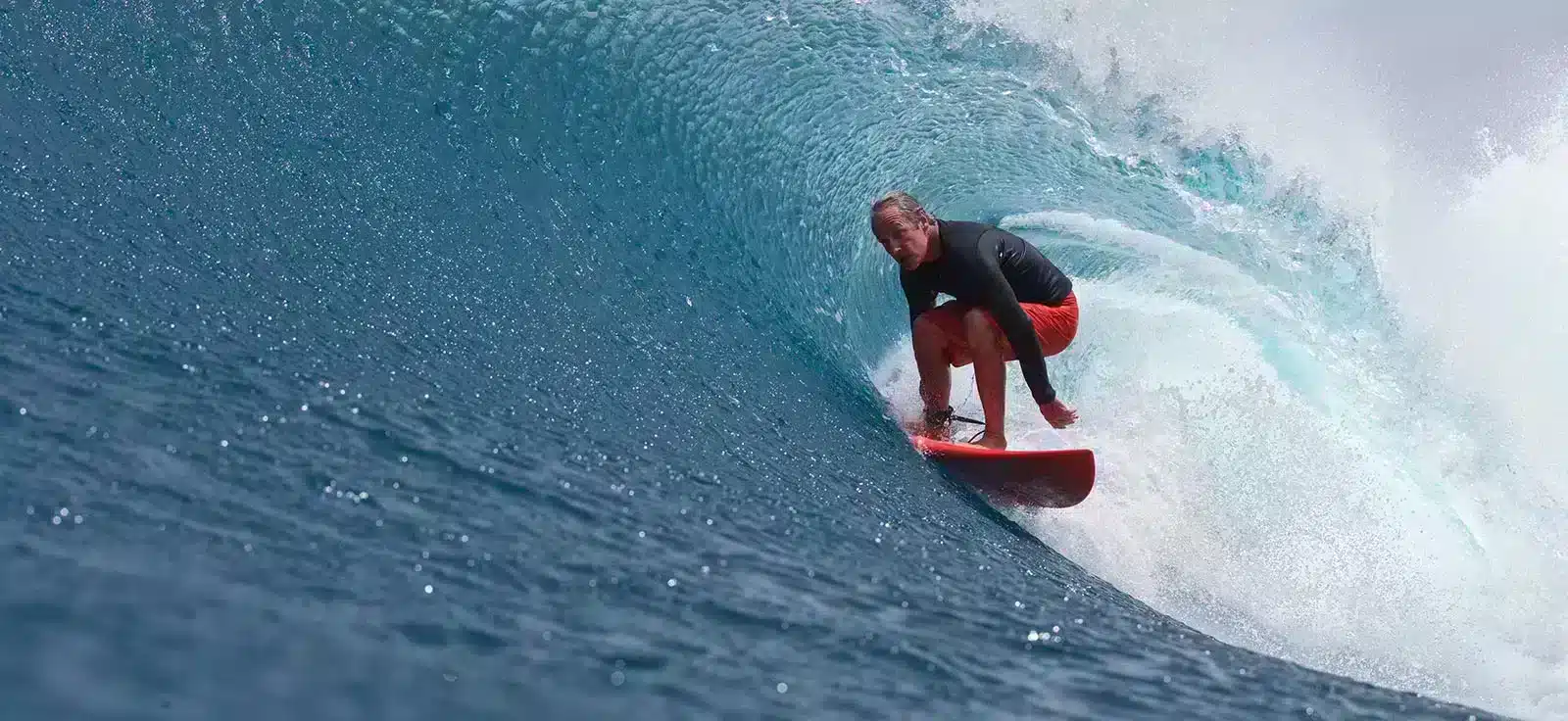 older man gets barreled on a wave in style